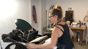 Jane printing our wedding invites using old school technology