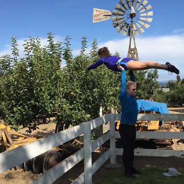 May 2016 picking apples acro style in Carmel
