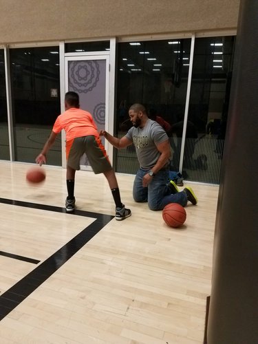 Coach John giving Amari some tips.